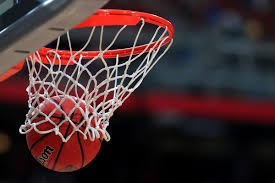 a basketball going through a net 